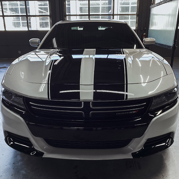 luxurious white and black car inside of shop